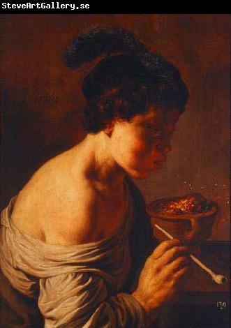 Jan lievens A youth blowing on coals.
